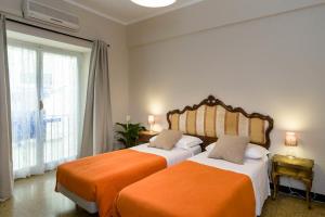 Postel nebo postele na pokoji v ubytování B&B I Portici Di Sottoripa