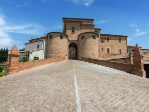 an entrance to a castle with a cobblestone driveway at Apartment Monsignore, Pesaro in Pesaro
