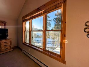 a room with a large window in a room at Trappers Crossing 8753 by SummitCove Lodging in Colorado in Keystone