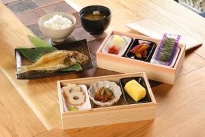 two wooden boxes filled with different types of food on a table at YASUYA-yasuya- in Yasugi +24 photos