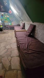 a room with two beds in a tent at Vila Druida Spa Caipira in São Thomé das Letras
