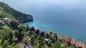 an aerial view of a house next to the ocean at Eco-tourist Dream Beach Cliff Villas in Nusa Penida +21 photos