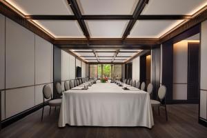 a conference room with a long table and chairs at Haig Court - Welcome Drink & Welcome Fruit in Shanghai