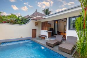 an image of a villa with a swimming pool at Ubud Mesari Private Pool Villa in Ubud