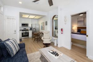 a living room with a couch and a room with a bed at Luxury At Pier Avenue in Oceano