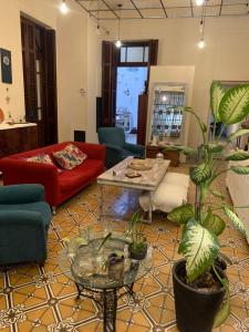 a living room with a couch and a table at Casa Boedo in Buenos Aires