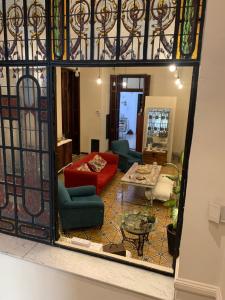 a view of a living room through a mirror at Casa Boedo in Buenos Aires