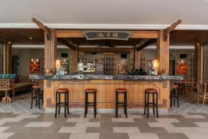 a bar in a restaurant with stools at AtEase Phuket Patong in Patong Beach +87 photos
