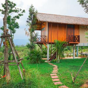 a house with a pathway leading to it at Baannok at Motakhian in Pak Chong