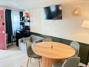a living room with a table and a couch at Riverwalk Park Inn in Chelan