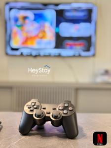 two video game controllers sitting on top of a table at Bali Residence Melaka By Heystay Management in Malacca