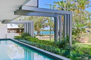 an image of a swimming pool in a house at Picnic Point Panoramic Views in Maroochydore