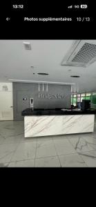 a picture of a kitchen with a counter top at Rochester Garden Condo in Manila