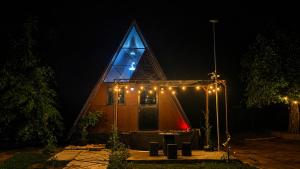 a church with a lit up building with lights at Ora sigiriya Cabana in Sigiriya