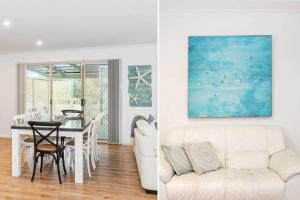 a living room and dining room with a white couch at The Salty Deck in Narrawallee +19 photos