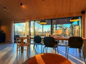 a dining room with a table and chairs at Architect-Designed House In Etelhem, Gotland in Stånga