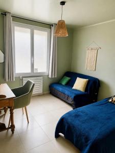 a bedroom with a bed and a couch and a desk at Villa Victoire au coeur de la Provence in Venelles +45 photos