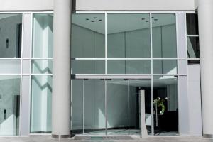 a glass facade of a building with a revolving door at Top Rentals Downtown in Buenos Aires