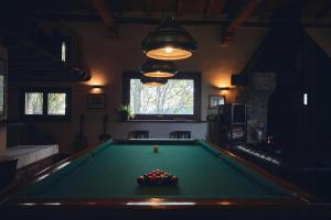 a billiard room with a pool table in it at Ancient Monastery In The Lariani Mountains in Cernobbio