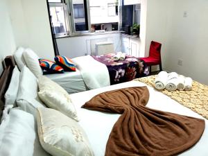 a bedroom with two beds with a blanket on them at Emerald Oceano Mar in Copacabana