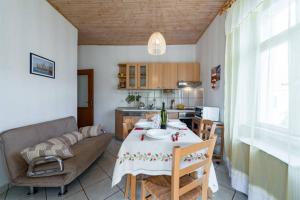 a living room with a table and a couch at Apartments LIMA Lazaneo in Jelsa