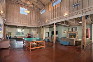 a large room with a ping pong table in it at Angels Camp Resort 3BR Apartment in Angels Camp +34 photos
