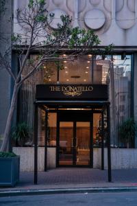 a building with a sign that reads the drowsy club at The Donatello Resort Studio Apartment in San Francisco +13 photos