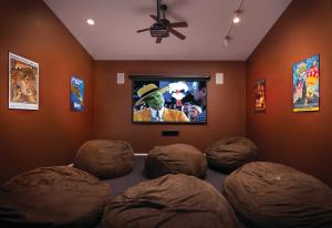 a room with four domed chairs in front of a television at Flagstaff Resort 2BR Apartment in Flagstaff