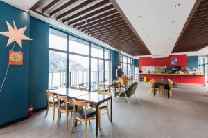 a dining room with tables and chairs and a star on the wall at Gapyeong Dolgorae Resort in Gapyeong +43 photos