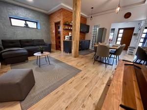 a living room with a couch and a table at BT Apartman in Miercurea-Ciuc