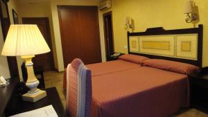 Кровать или кровати в номере PARAISO PLAYA Hotel
