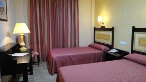 Кровать или кровати в номере PARAISO PLAYA Hotel