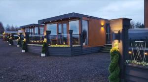 a building with a lot of windows and lights at Fa'side Lodge in Musselburgh