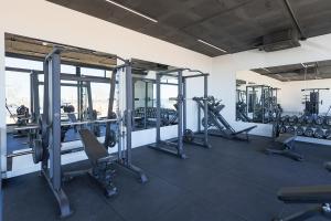 a gym with several treadmills and exercise bikes at Villa Don Grosa - Luxury Family Retreat in Torre-Pacheco