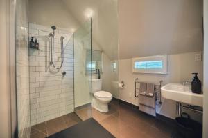 a bathroom with a shower and a toilet and a sink at Briarwood in Greytown +38 photos