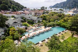 an aerial view of a resort pool with umbrellas at PP Princess Resort in Phi Phi Islands