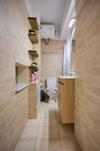 a bathroom with a toilet and a sink at Bella Casa Chios in Chios