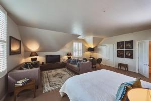 a bedroom with a bed and a living room at Briarwood in Greytown
