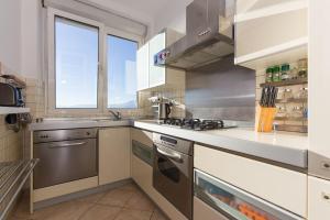 Kuchyň nebo kuchyňský kout v ubytování Apartment Arcadia