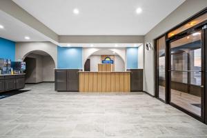 a lobby of a store with a counter at Days Inn by Wyndham Troy in Troy +30 photos