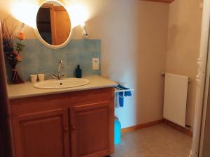 a bathroom with a sink and a mirror at Le Logis de bouillé in Bouillé-Courdault +16 photos