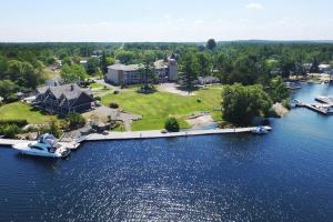 an aerial view of a house with a dock in the water at Rawley Resort, Spa & Marina, Trademark Collection by Wyndham in Port Severn