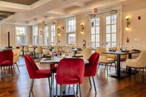 a restaurant with tables and chairs in a room at Rawley Resort, Spa & Marina, Trademark Collection by Wyndham in Port Severn