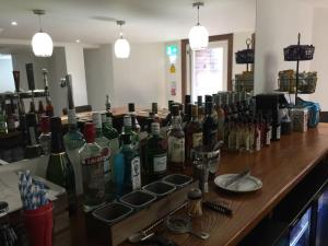 a bar with a bunch of bottles of wine at Marlborough Hotel in Liverpool +13 photos