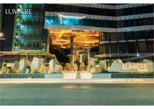 a store front of a building at night at Lumière Royal Sky Residence in Ho Chi Minh City