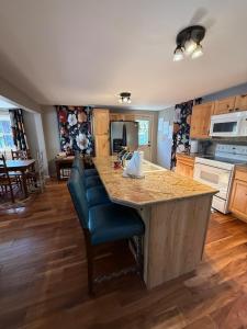 a kitchen with a large island with a counter top at Rising Sun Rustic Retreat in Roach