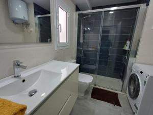 a bathroom with a sink and a toilet and a shower at Carbo Home y Garaje , Algemesí Home in Algemesí +16 photos