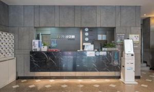 a store front with a counter in a building at Bugok Hanseong Hotel in Changnyeong