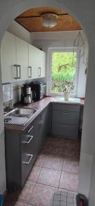 a kitchen with a sink and a window at Ferienhaus an der Elde in Lübz