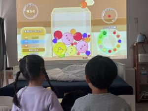 two young children looking at a large screen at Residence Hotel Kamoike in Kagoshima +27 photos